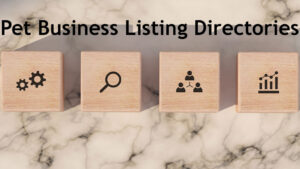 A marble-textured background with four wooden blocks placed in a row. Each block features a black icon: gears for settings or automation, a magnifying glass for search, three connected people for networking, and a bar chart with an upward trend for business growth. Above the blocks, bold black text reads Top Pet Business Listing Directories, representing resources for pet businesses to gain visibility and expand their reach.